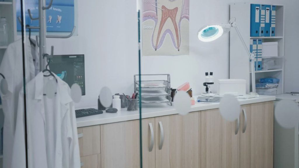 Family Dentist in Atlantis Florida Modern dental office interior with a mirror and sink, representing the clean and professional environment at Smiles Dentistry in Atlantis, FL.