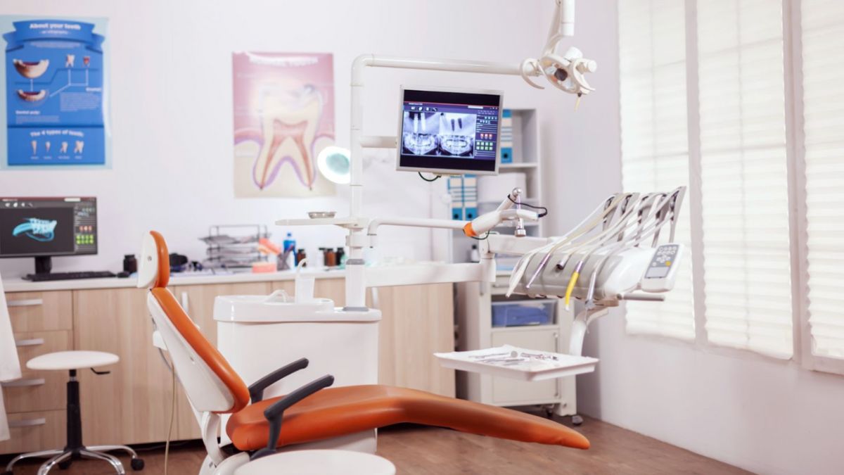 Interior of a dental office showcasing a chair and a television in Lantana, FL.