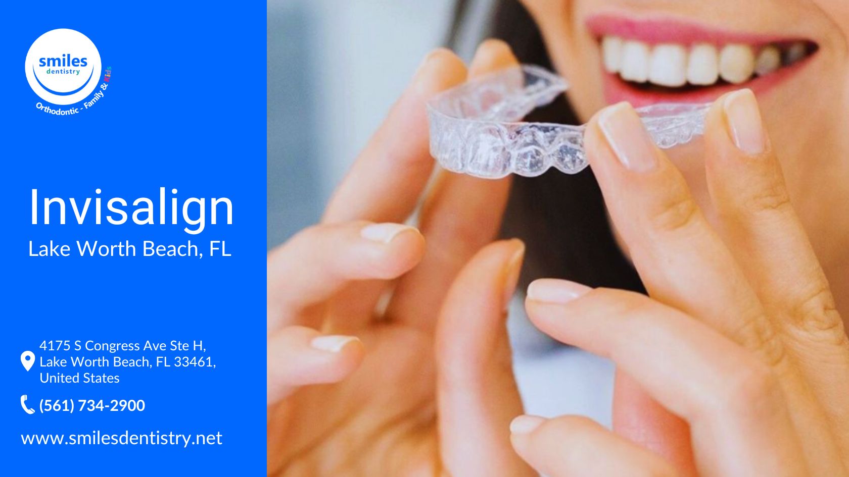 A smiling woman holds a clear Invisalign aligner near her teeth, ready to place it in her mouth.